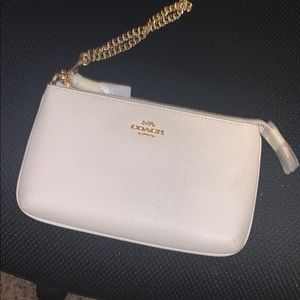 Coach chalk colored wristlet